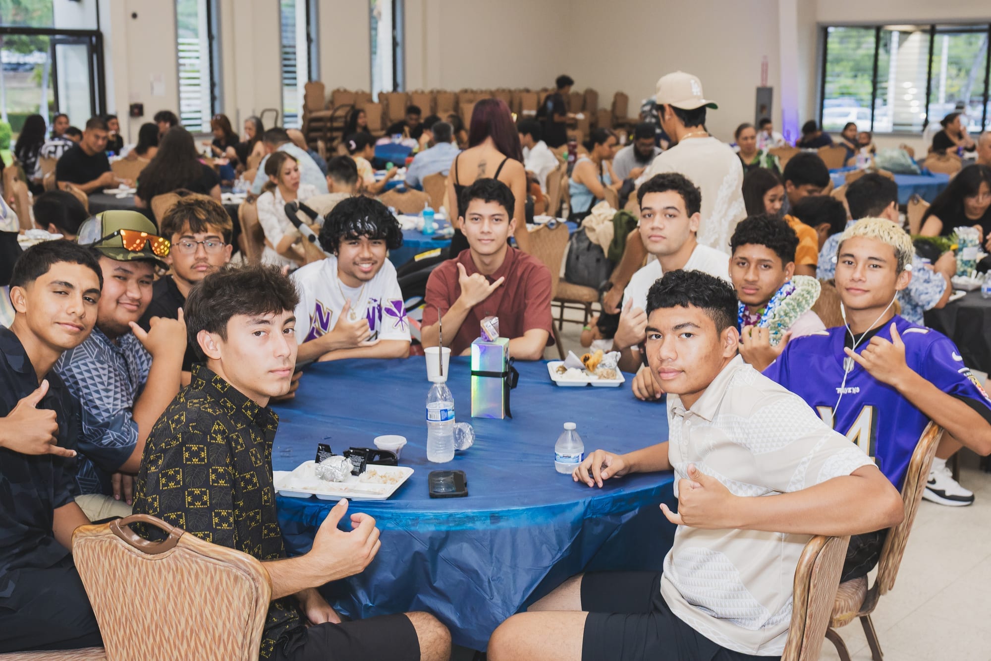 Family celebrating a graduate at a Hawaii graduation party