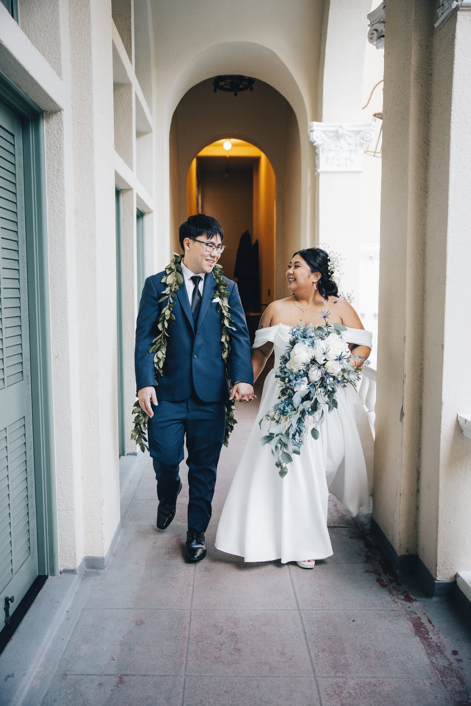 Newlyweds during golden-hour portraits after their Oahu wedding