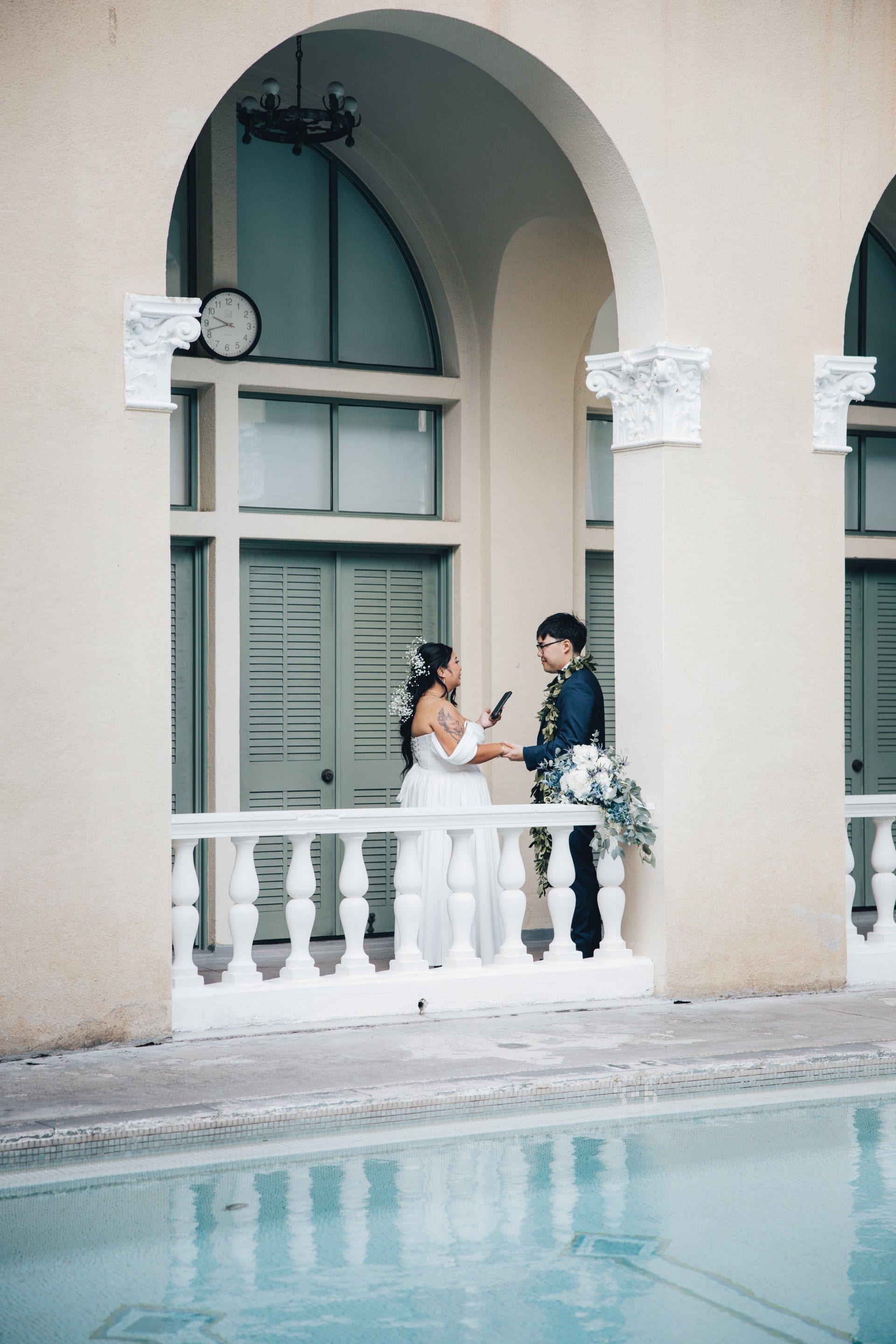 Newlyweds share first kiss on steps of historic YWCA Honolulu wedding venue